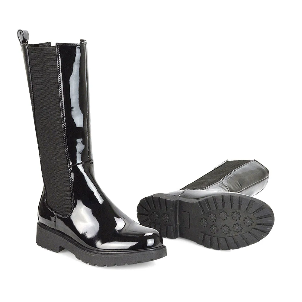 Suzie Flat Low Block Heel Slip on below the Knee Biker Boots in Black Patent